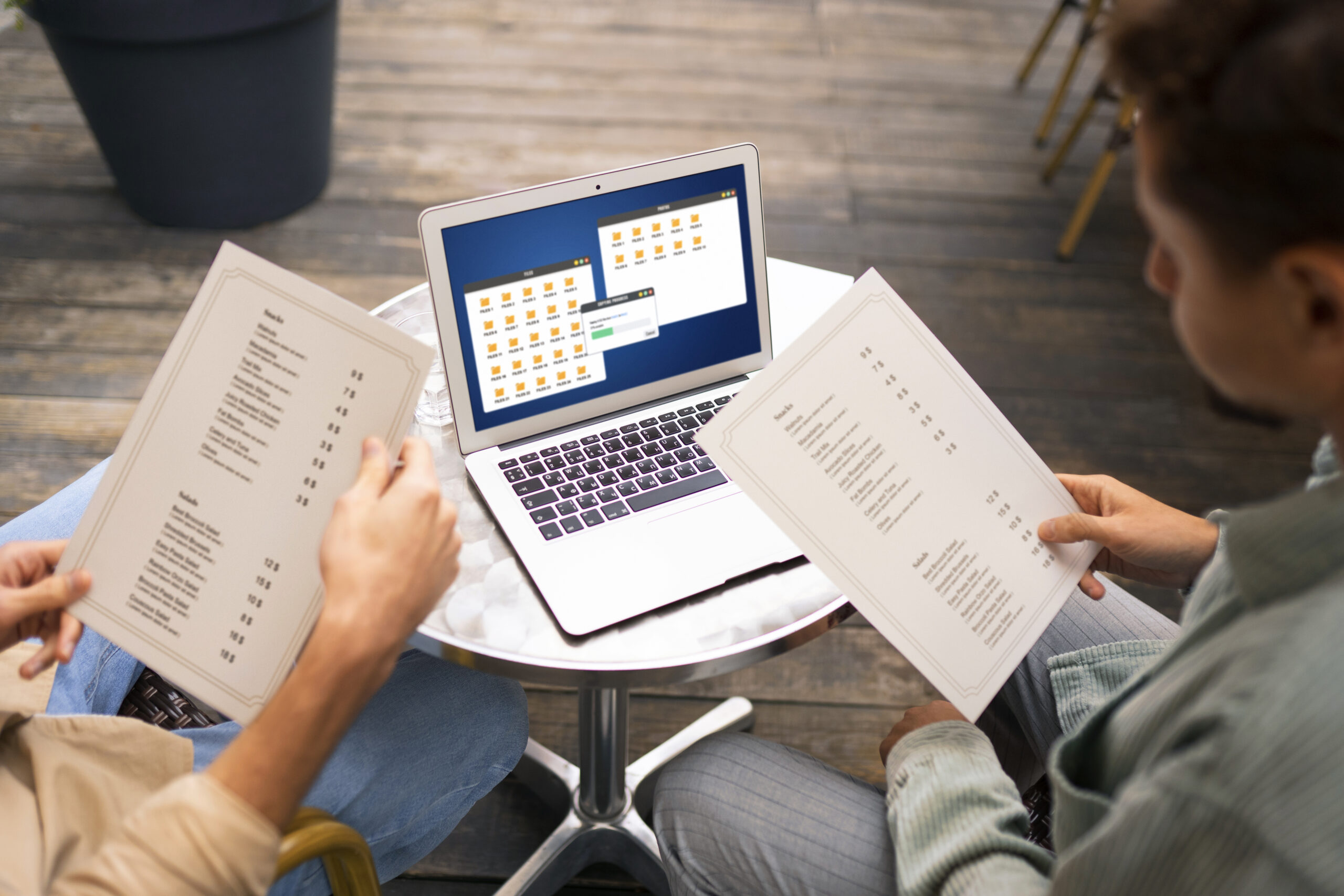 high-angle-friends-holding-menus